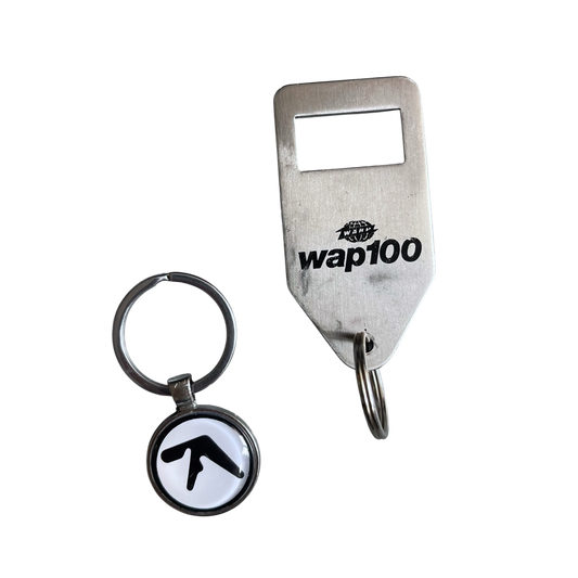 Early 2000s Warp Records bottle opener / key ring
